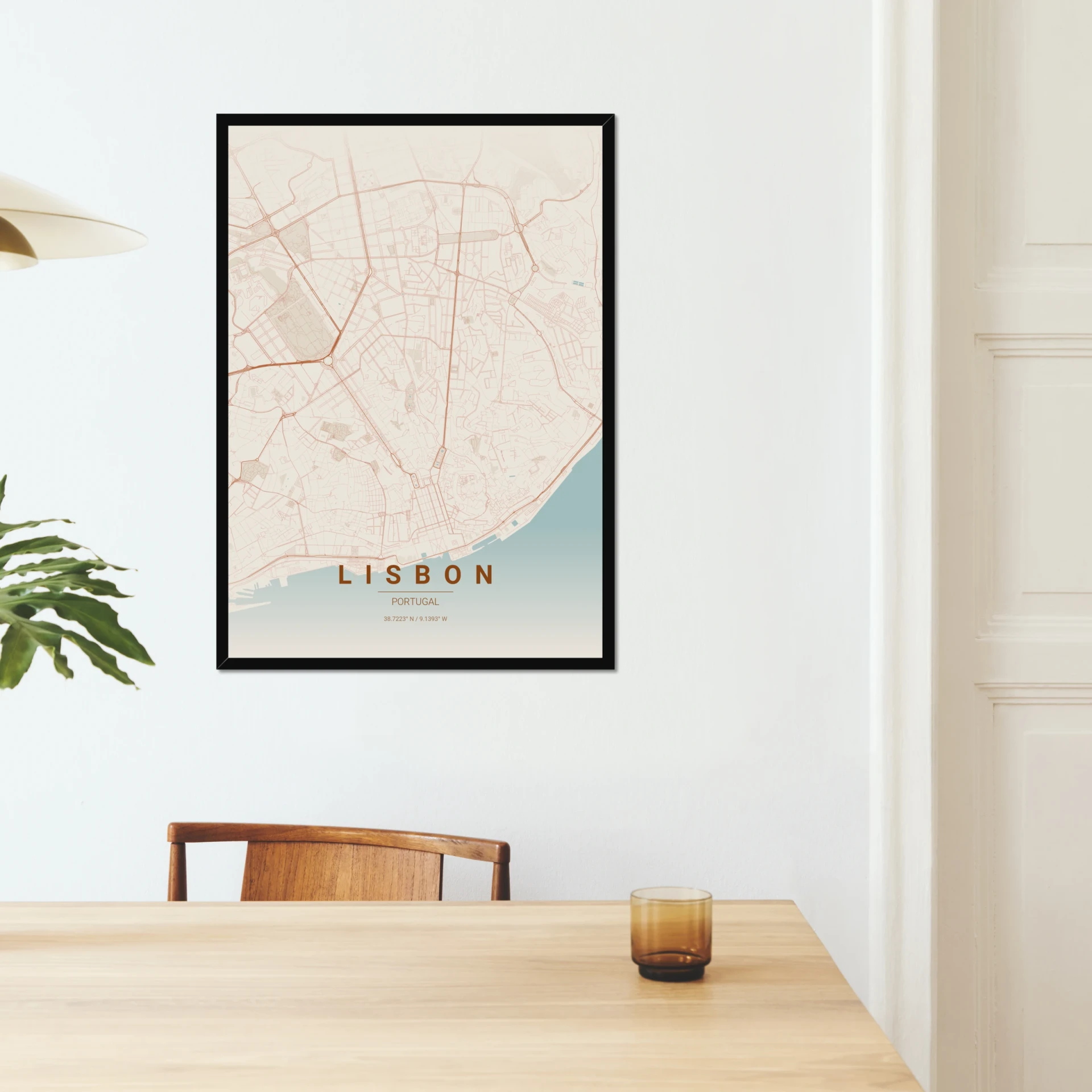 Lisbon map poster in a black A1 frame, hung in a dining room